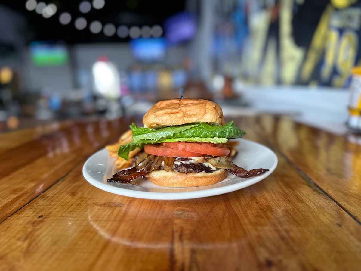 a close up of a sandwich sitting on top of a wooden table